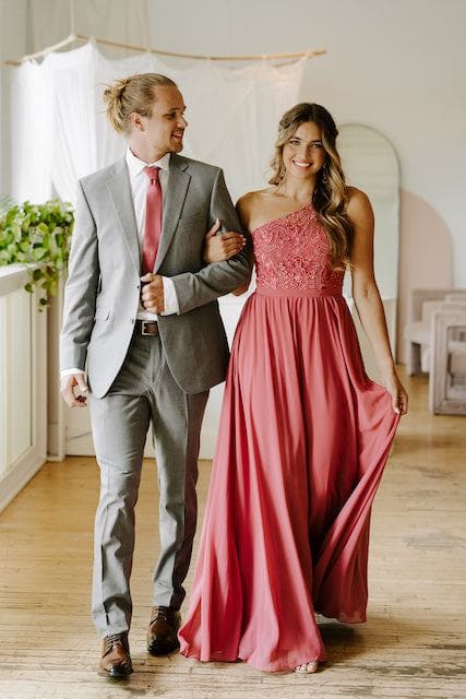 Bridesmaid and groomsmen walk, bridesmaid wearing Kennedy Blue embroidered dress