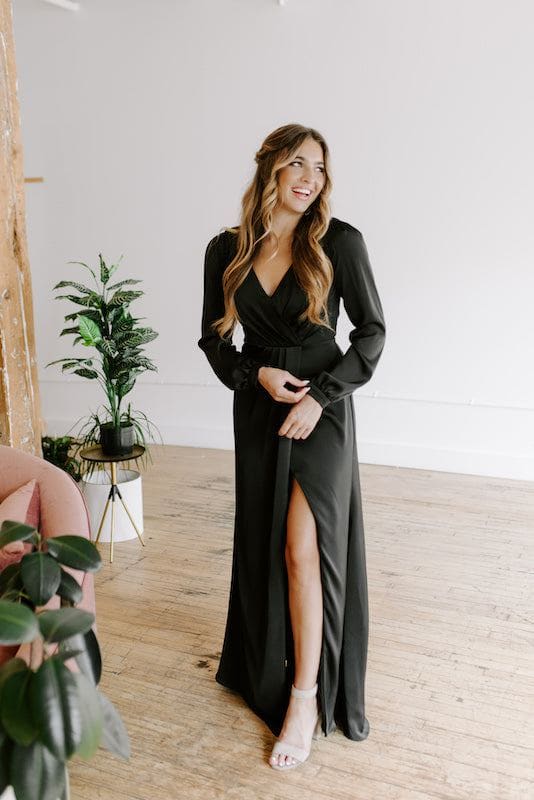 Model wears Kennedy Blue bridesmaid dress in black satin