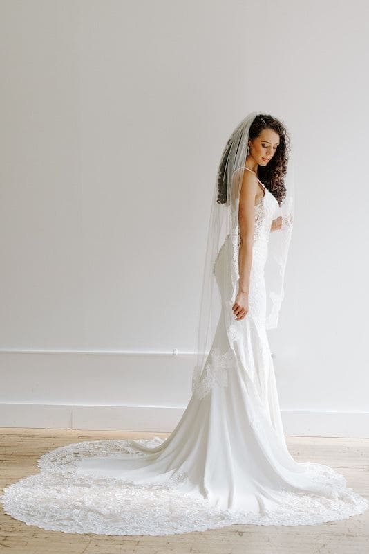 https://www.kennedyblue.com/cdn/shop/files/BridewithKennedyBlueVeil.jpg?v=1692894341&width=1000