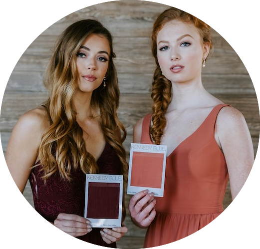 Kennedy Blue bridesmaids hold matching color swatches