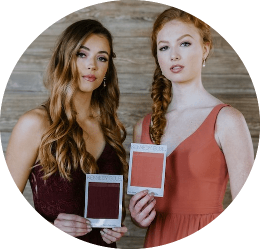 Kennedy Blue bridesmaids hold matching color swatches