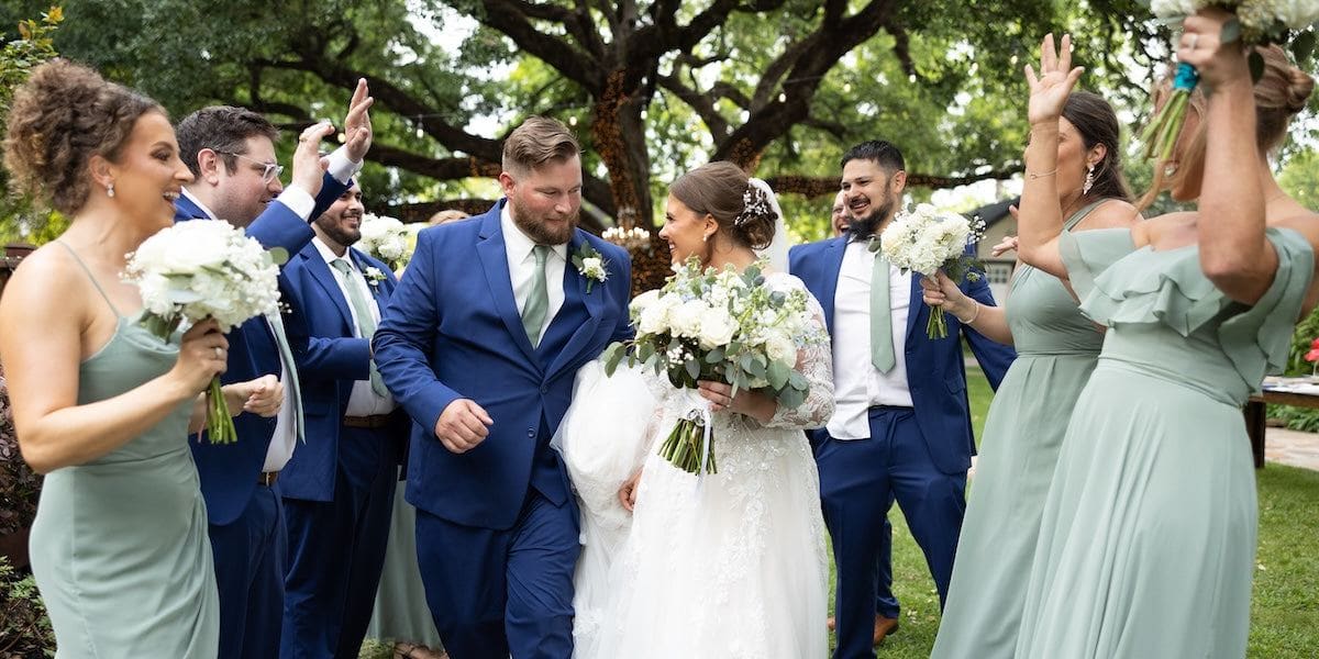 Groomsmen in coordinated rental suits and tuxedos