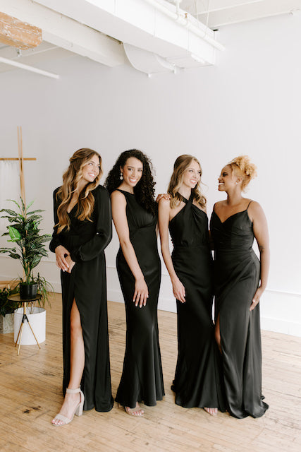 Group of bridesmaids wear black satin Kennedy Blue dresses