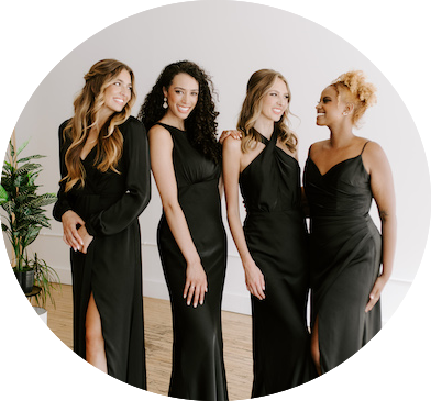 Group of bridesmaids wear Kennedy Blue satin dresses in black