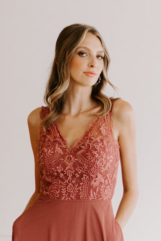 Model wears embroidered top bridesmaid dress