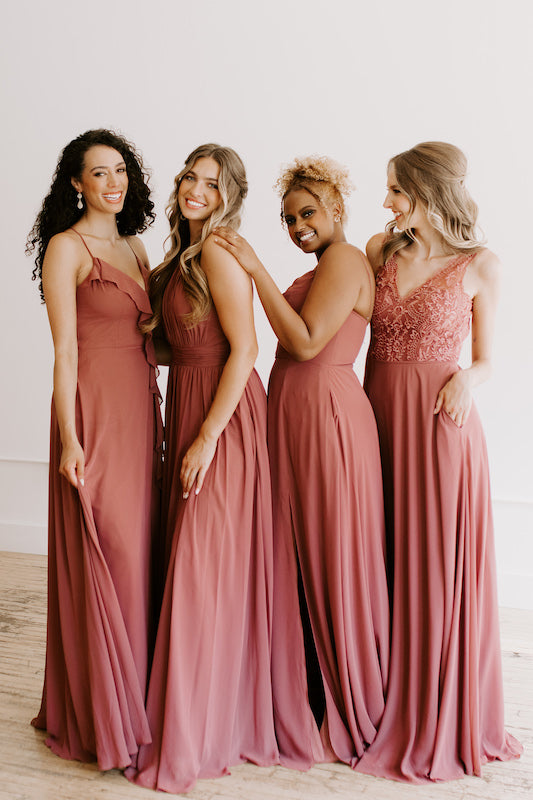 Group of bridesmaids wear Kennedy Blue chiffon dresses in color rosewood